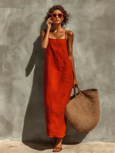 Vue extérieure d'une femme portant une robe longue en coton et lin orange de style chic