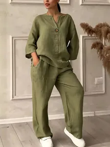 A detailed look of olive green linen-style casual set featuring a V-neck top and wide-leg pants