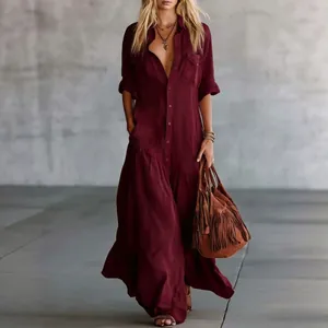 Elegant burgundy long sleeve maxi shirt dress with buttons and side pockets.