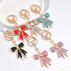 Detailed view of elegant rhinestone bow-knot keychains available in six vibrant colors