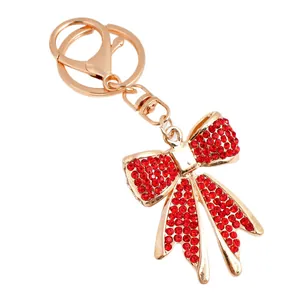 Sparkling red rhinestone bow keychain with gold lobster clasp for women's bags and car keys