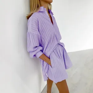 Fashionable purple striped two-piece set with puff sleeve shirt and matching shorts