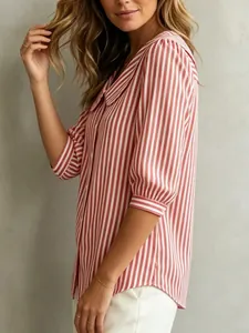 Side view detail of a red and white vertical striped women's blouse with cuffs