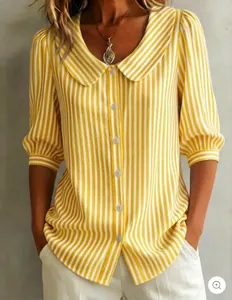 Close-up detail of Peter Pan collar and puff sleeves on a yellow striped commute shirt