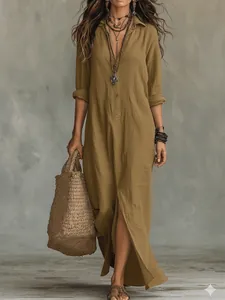 Detail view of a casual solid color lapel maxi dress with front slit and straw bag