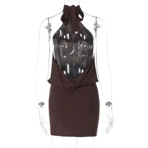 Detail view of a chocolate brown halter backless mini dress with a tied bow neck design.
