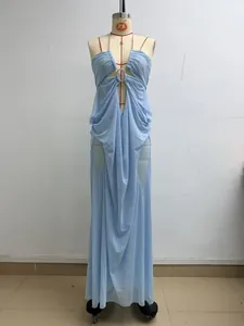 Detailed view of a light blue sheer mesh halter maxi dress displayed on a dress form mannequin.