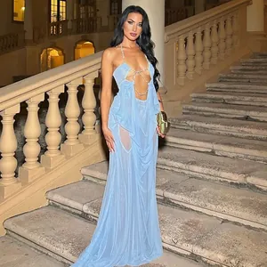 Detailed shot of a sexy light blue mesh sheer halter maxi dress with decorative chains