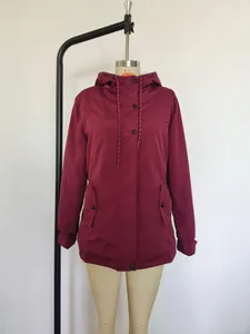 Close-up front view of a wine red hooded jacket on a mannequin with pocket details