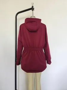 Detailed back view of a burgundy hooded winter jacket for women featuring a drawstring waist