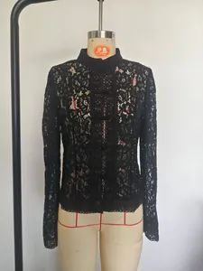 Detailed view of women's black lace crochet stand collar shirt with elegant frog buttons