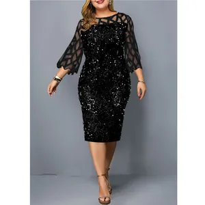 Detailed view of an elegant black sequined party dress featuring mesh patchwork sleeves