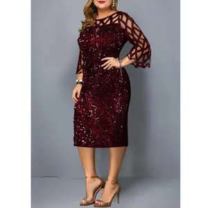Detailed view of the maroon sequined cocktail dress with elegant mesh patchwork sleeves.