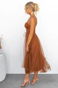 Side view of elegant brown mesh strap evening dress with layered tulle skirt for women