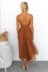 Back view of a rust brown mesh evening maxi dress with elegant cross strap design