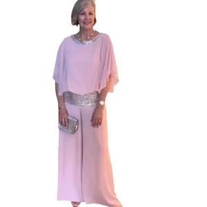 Elegant pink two-piece set for women featuring a sequin batwing top and wide leg pants.