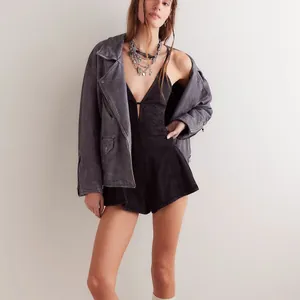 Chic black denim romper with deep V-neck paired with grey oversized jacket