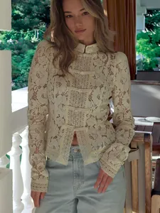 Elegant lace crochet shirt featuring a stand collar and decorative front buttons