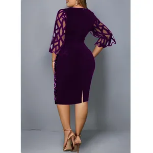 Back view of elegant purple cocktail dress with mesh bell sleeves and side sequins