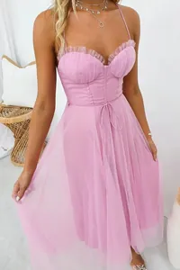 Detail showing the delicate pink mesh fabric and tiered bust design of this elegant gown.