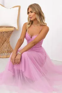 Elegant pink mesh evening dress with spaghetti straps and a flowing tulle skirt.