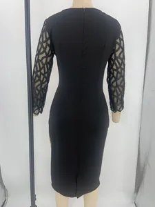 Detailed back view of a slim black midi dress featuring patterned mesh sleeves and zipper