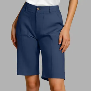 Detail of navy blue high-waisted bermuda shorts for women in a professional studio shot.