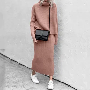 Model wearing a stylish two-piece knit set with turtleneck sweater and long skirt