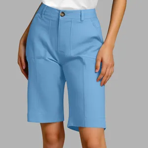 Detail view of light blue women's high-waisted Bermuda shorts with large pockets