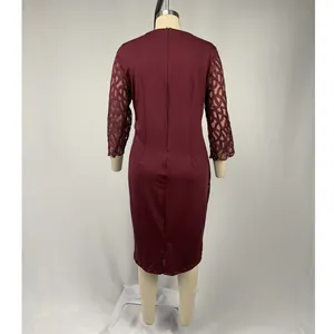 Back view of wine red party dress with mesh patchwork lace sleeves and round neck.