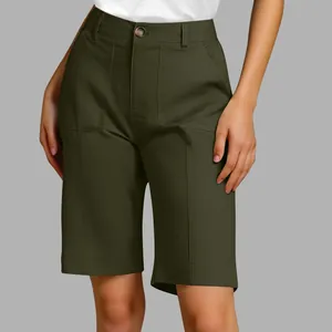 Detail view of high-waisted olive green Bermuda shorts with front pockets and seam lines.