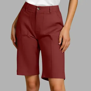 Detailed view of women's burgundy bermuda suit shorts with front pockets and button closure