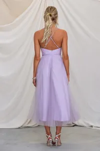 Back view of lavender tulle evening dress showing elegant criss-cross straps and open back detail