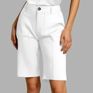 Close-up detail of high-waisted white tailored bermuda shorts for women's summer wear