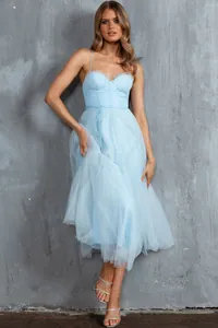 Close-up of light blue mesh evening dress with detailed ruffles and corset bodice