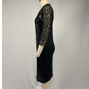 Side view of slim black sequined party dress with mesh lattice 3/4 sleeves detail