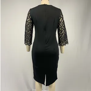 Detail back view of a black slim fit midi party dress with mesh 3/4 sleeve design