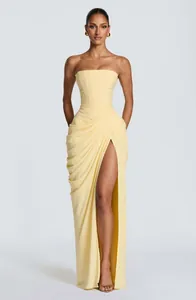 Elegant strapless yellow maxi dress with asymmetrical pleats and high leg slit detail