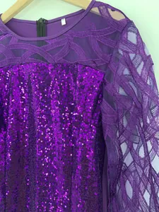 Macro detail of a vibrant purple party dress featuring sequins and mesh lace texture