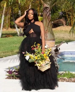 Elegant black mesh evening dress with corset bodice and tiered tulle skirt