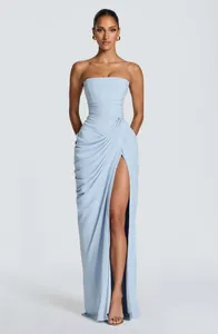 Light blue strapless evening gown with asymmetrical ruching and a high leg slit detail
