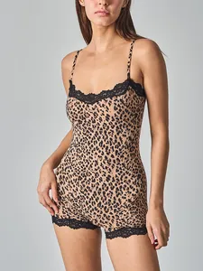 Detailed view of women's leopard print bodysuit with black lace trim and straps.