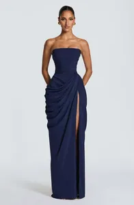 Elegant navy blue strapless maxi dress with asymmetrical pleats and high leg slit