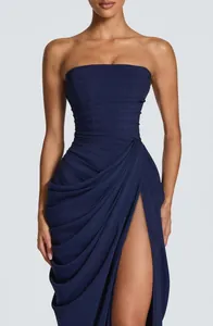 Macro detail view showing the ruched fabric and high slit of this navy blue strapless gown