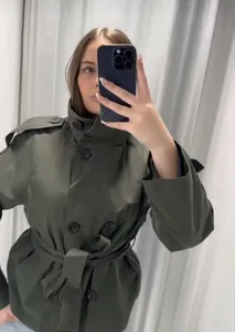 Stylish olive green double-breasted short trench coat with vintage lapel and belted waist