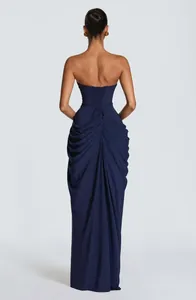 Back detail view of an elegant navy blue strapless corset dress with pleated draping