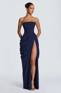 Full view of elegant navy blue asymmetric pleated strapless maxi dress with high slit