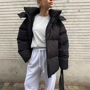 Loose black winter puffer jacket for women with hood, streetwear style warm coat