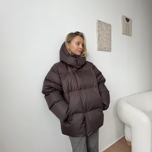 Modern brown hooded oversized puffer jacket for women's winter fashion