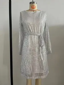 Close-up of silver sequin party dress on mannequin featuring elegant waist tie detail